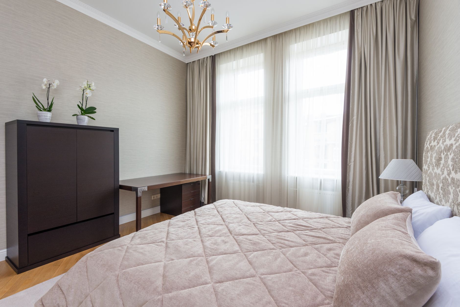 Interior of modern furnished bedroom