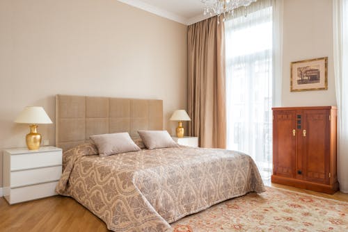 Classic interior of bedroom with panoramic window