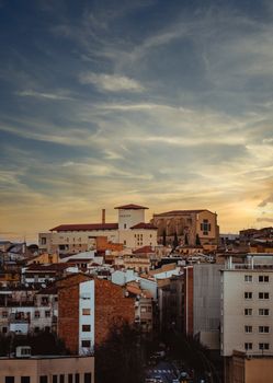 Aerial view of Manresa, Spain, showcasing its urban landscape and historic architecture at sunset.