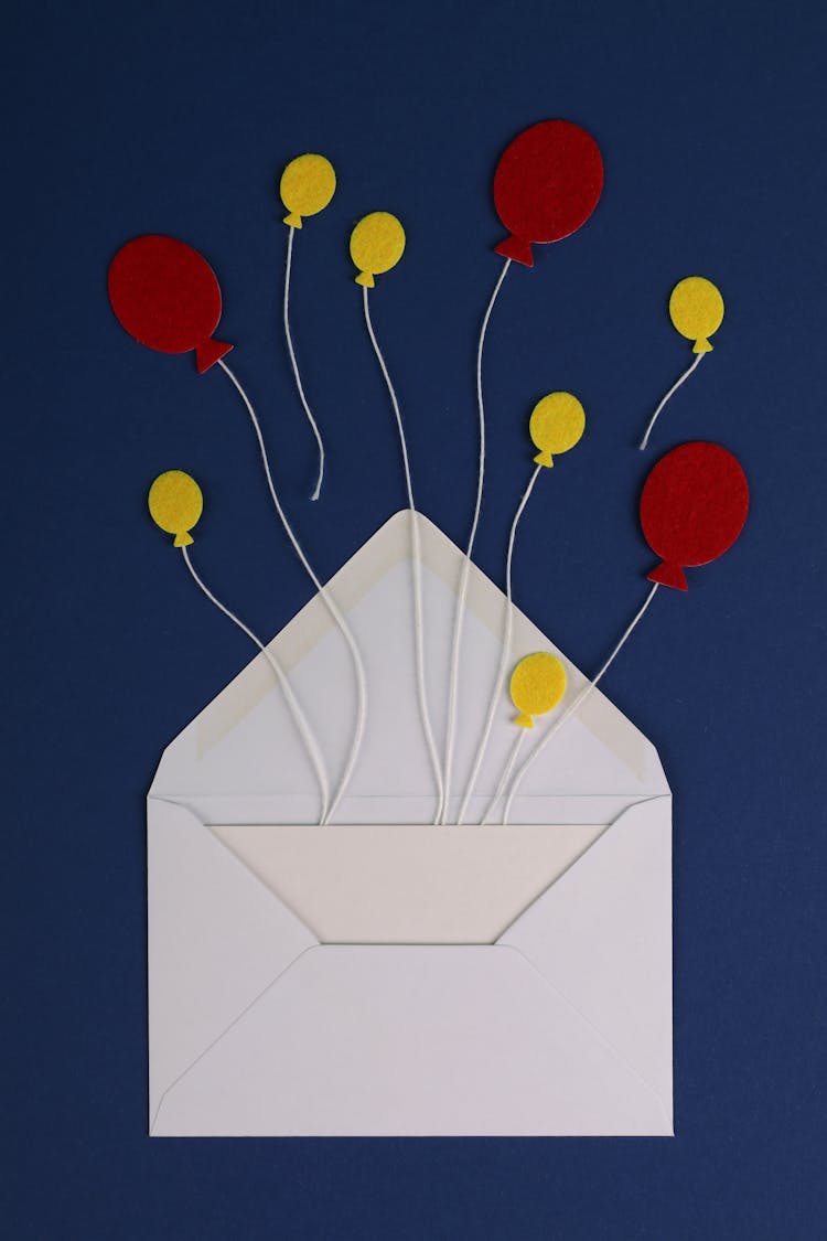 Envelope With Paper Balloon Shapes On Strings 