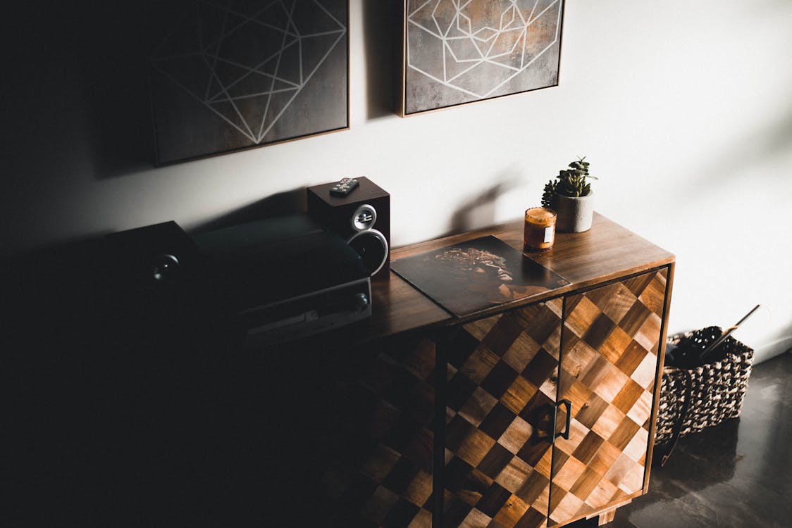 Black Stereo Component on Brown Wooden Dresser Console