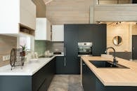 Modern kitchen with matte cupboards and built in appliances