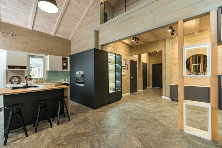 Spacious Hallway Leading To Modern Kitchen In Minimalist Styled House