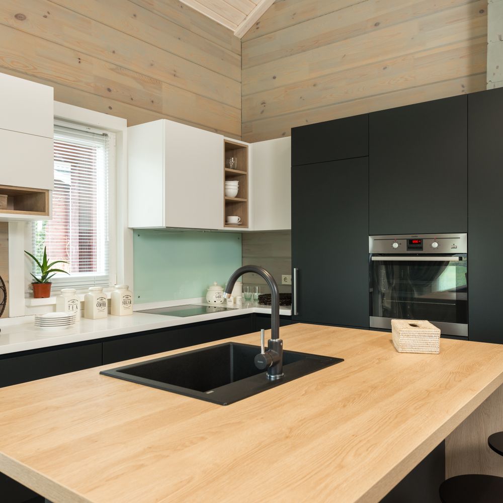 Kitchen Spraying in Beckenham — careful masking before painting begins