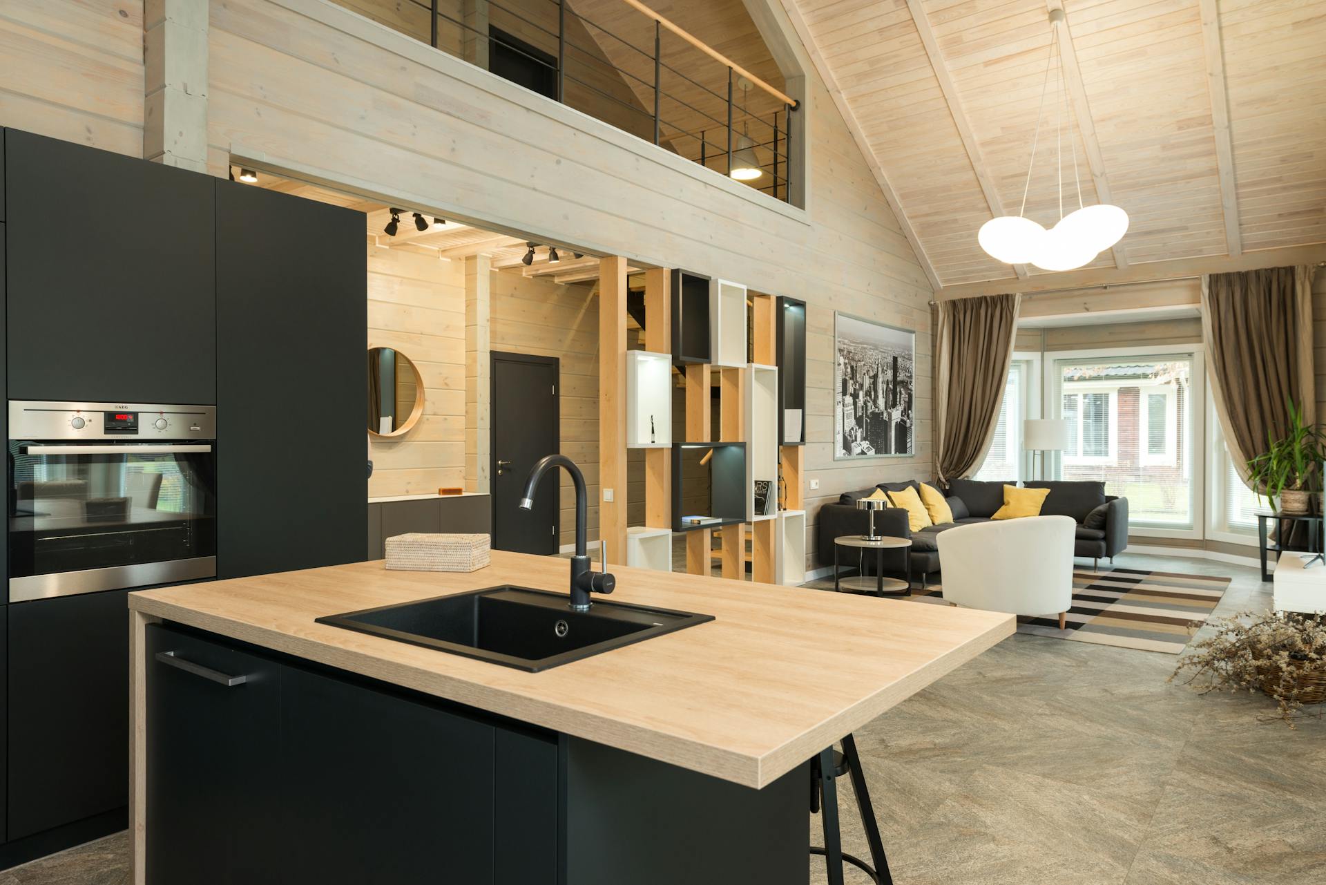 Black Faucet and Black Sink on Brown Wooden Counter Top