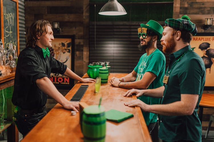 Men Standing At The Bar