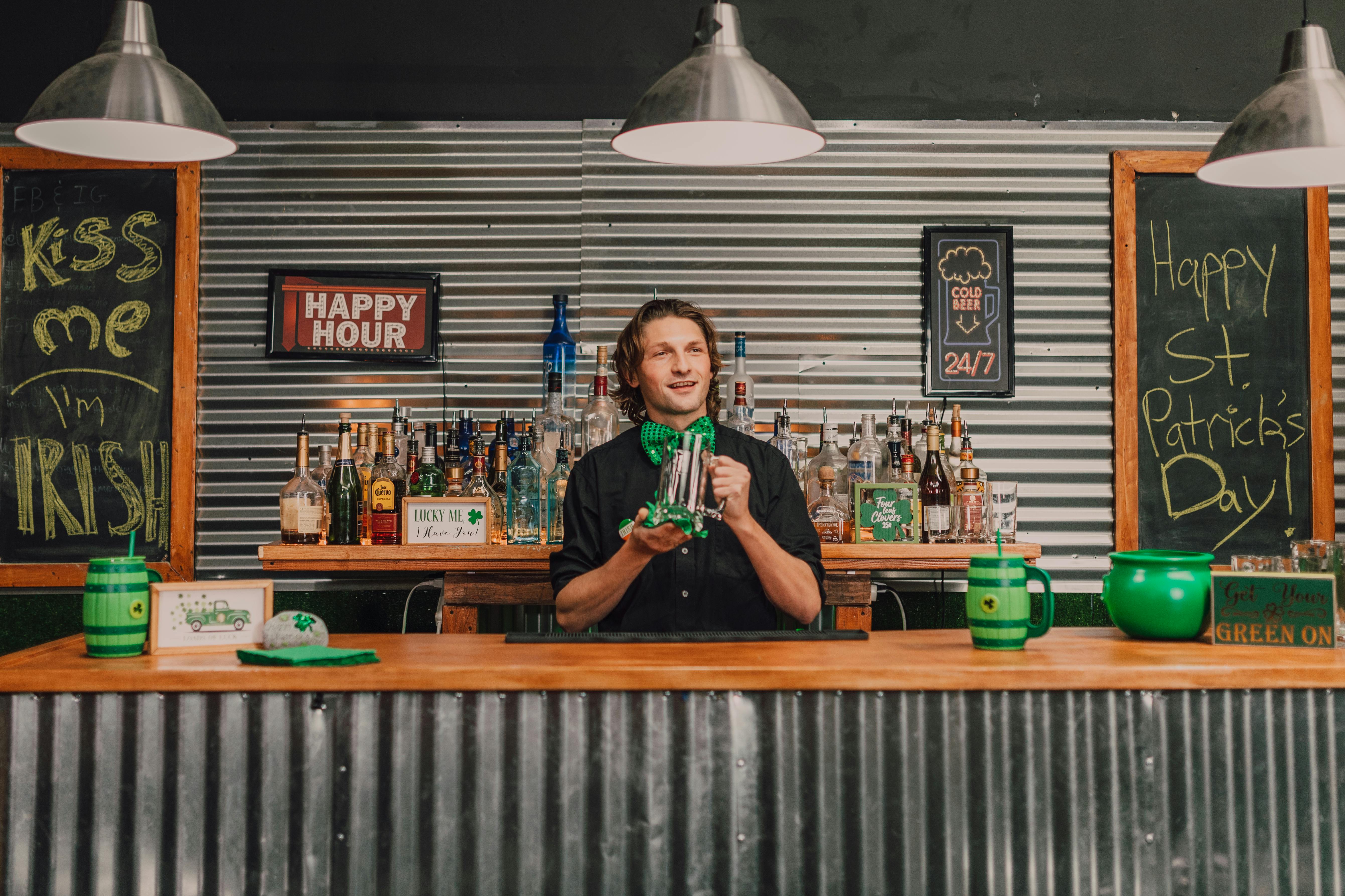 a bartender wiping a mug