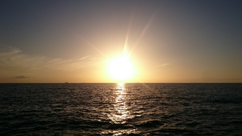 Free Breathtaking sunset over the ocean in Arona, Spain. Perfect for scenic and travel themes. Stock Photo