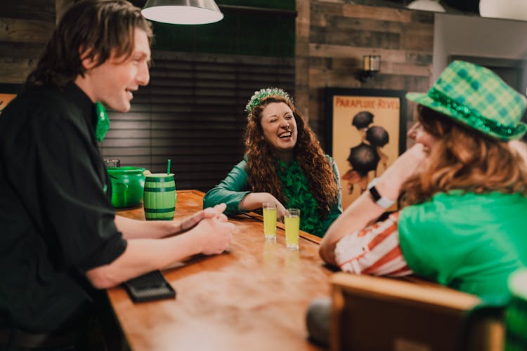 People Celebrating The Holiday In A Bar