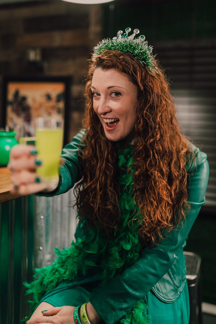 A Happy Woman Holding A Drink