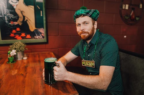 A Man Drink a Mug of Beer