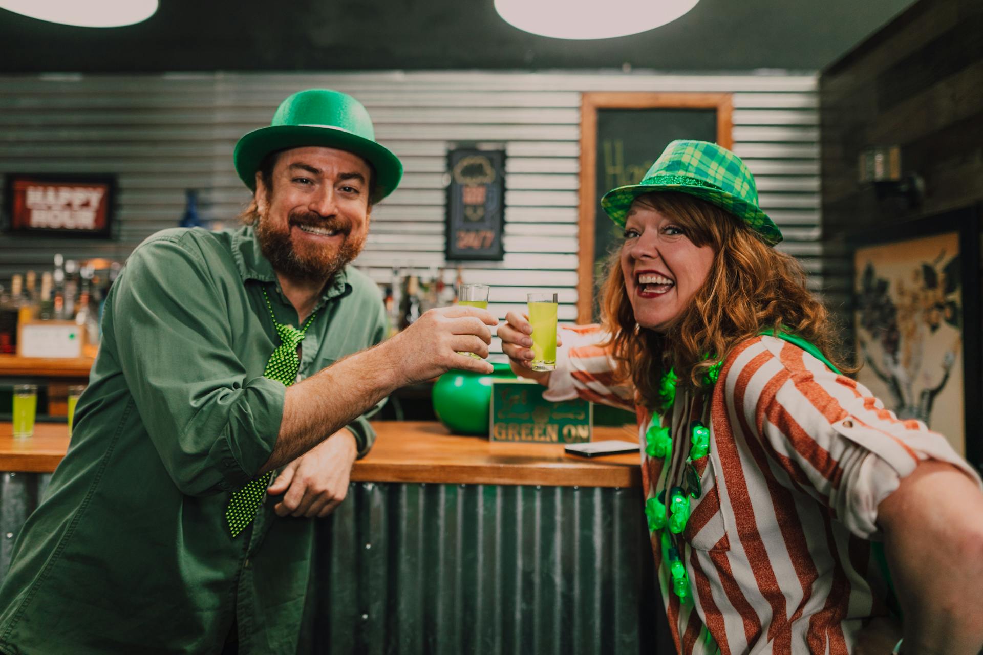 A Man and a Woman Drinking at a Bar in Celebration of St Patrick's Day