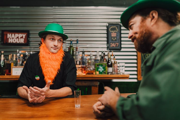 A Bartender And A Man Looking At Each Other