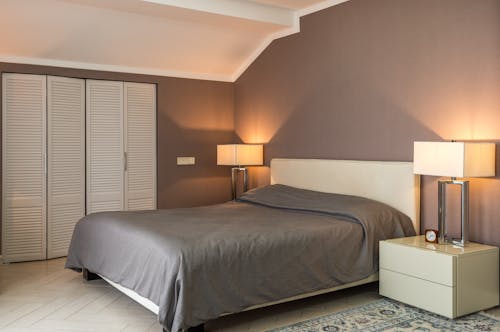 Bedroom interior with geometric lamps and ceiling