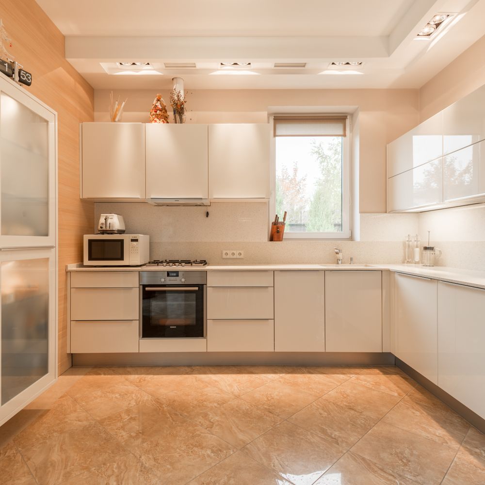 Kitchen Spraying in Fulwell — clean edges cut in around trim and sockets