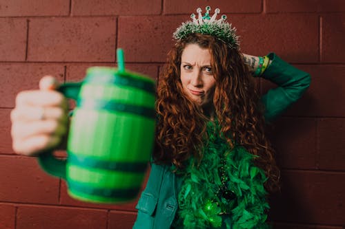 A Woman Holding a Green Mug