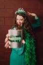 A Woman Holding a Hip Flask