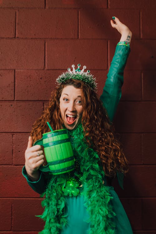 Woman in a Green Dress Holding a Barrel Mug