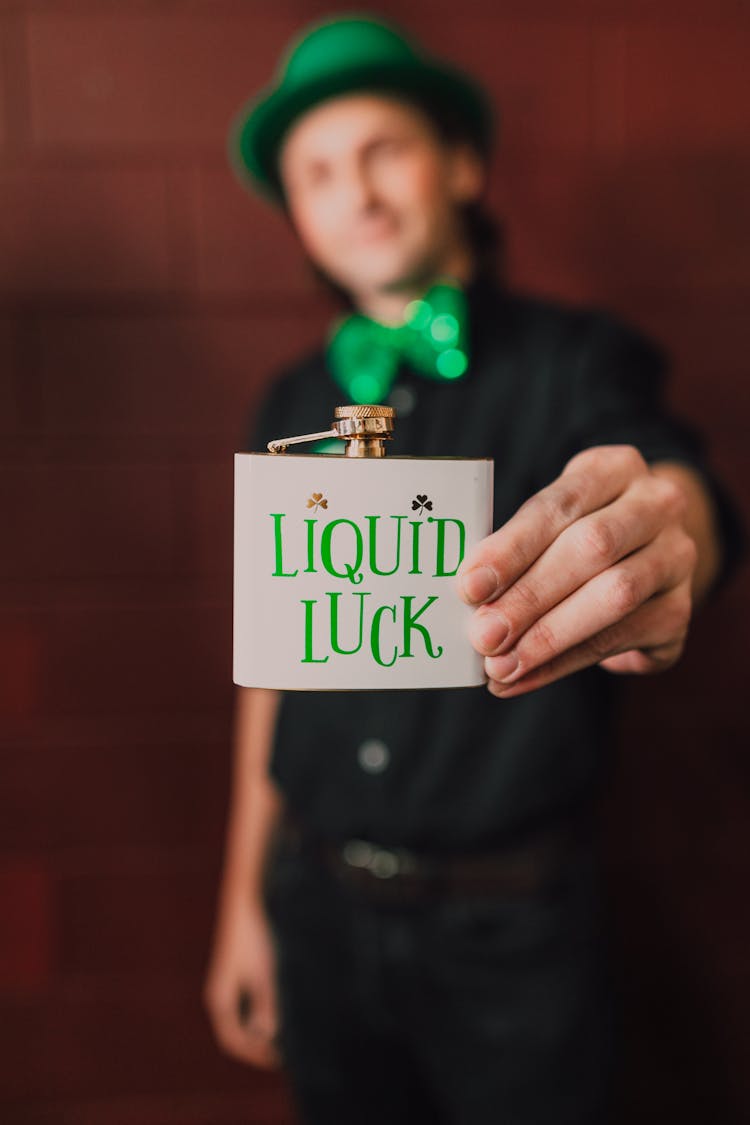 Man Holding A Hip Flask