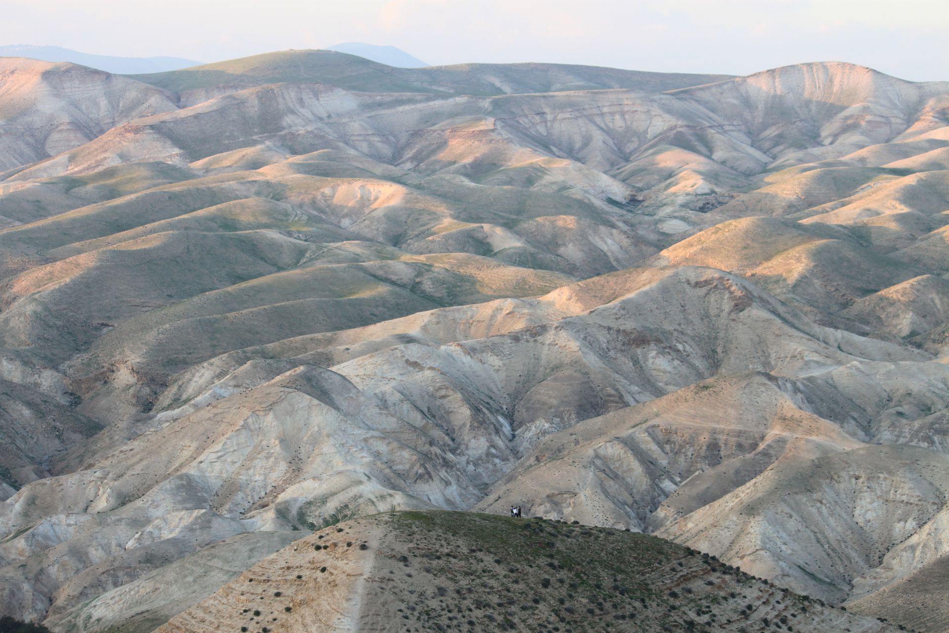 Breathtaking aerial view of desert mountains in Israel at sunset, showcasing dramatic landscapes and natural beauty.