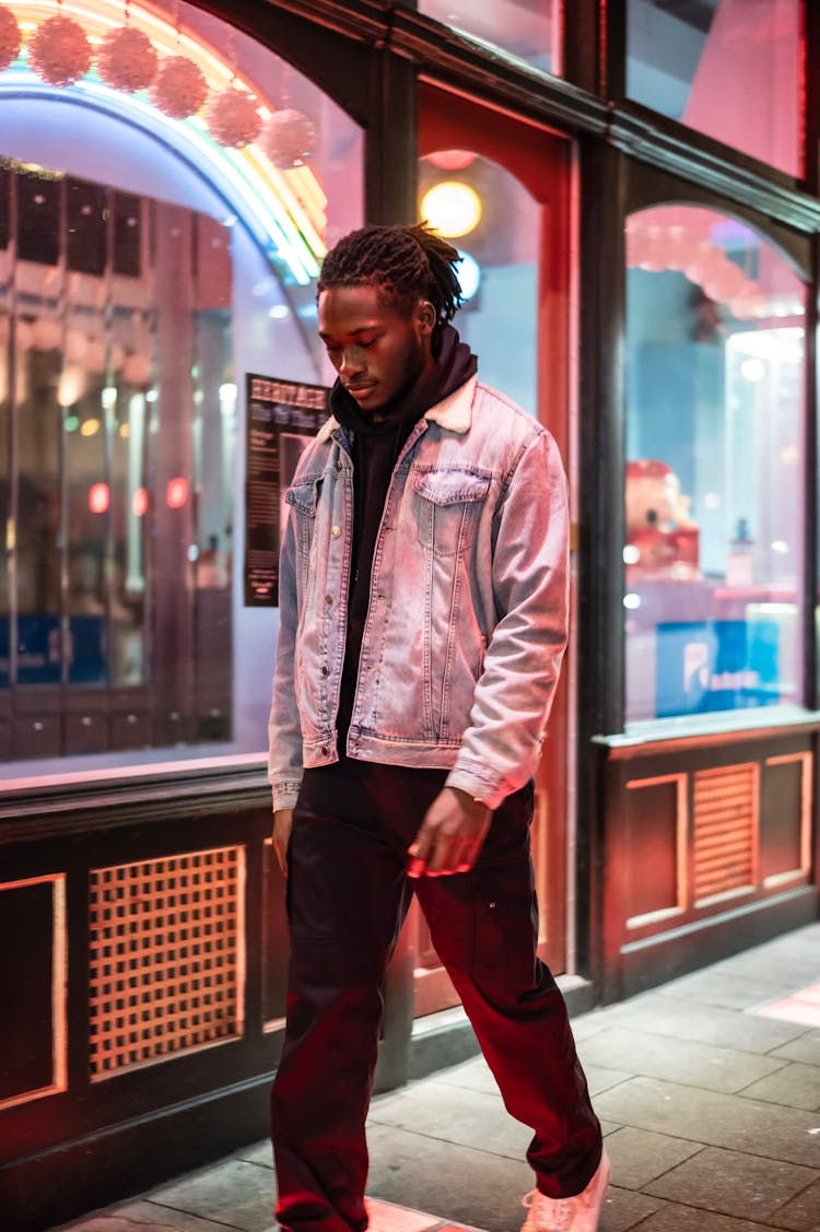 Stylish Black Man Walking On Street In Evening Time