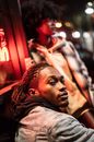 Cool black man against friend in night town