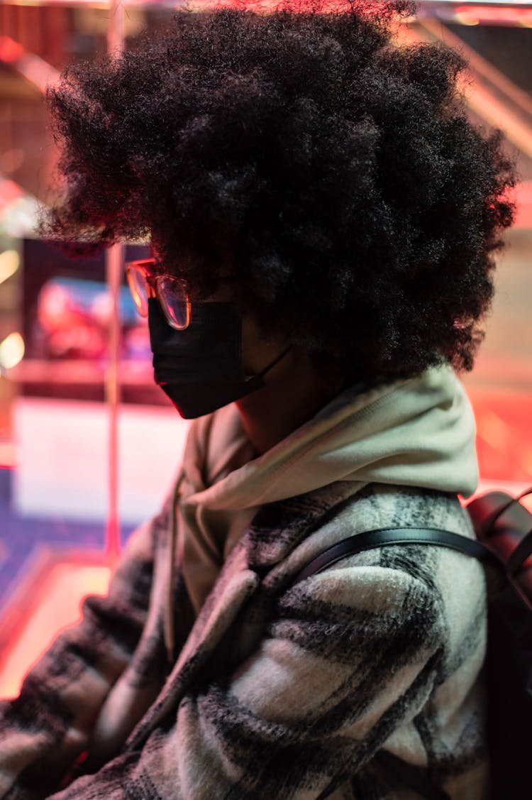 Unrecognizable Black Woman In Fabric Mask With Afro Hairstyle