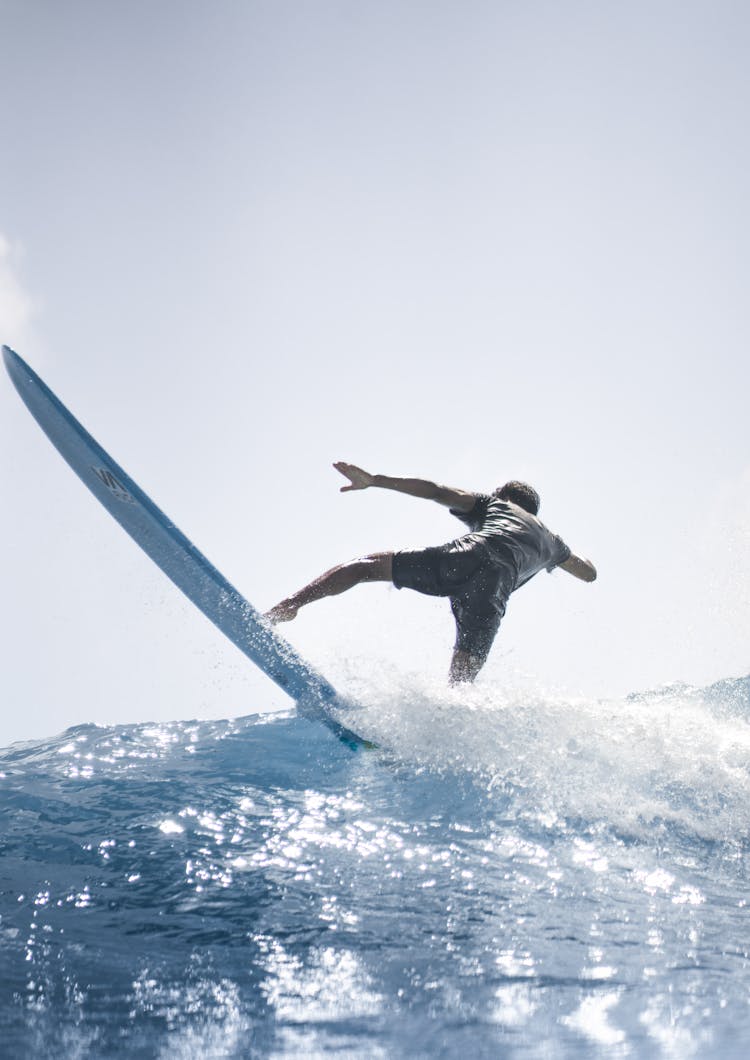 Powerful Man On Surfing Board In Water