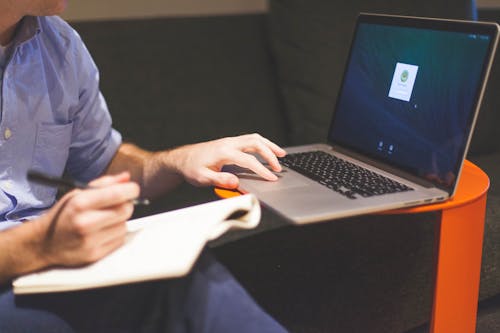 Free Man Using Macbook Stock Photo