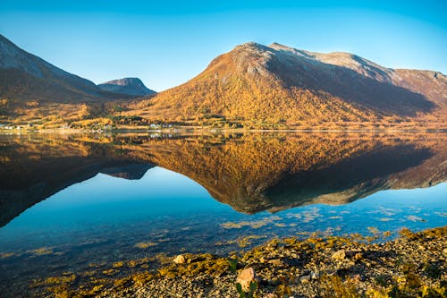 Landscape Photo of Mountains and Body of Water