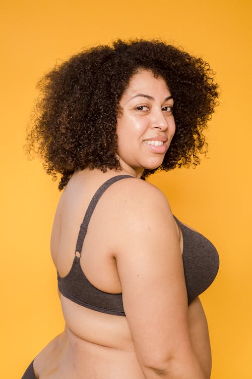 Cheerful plus size African American model in underwear