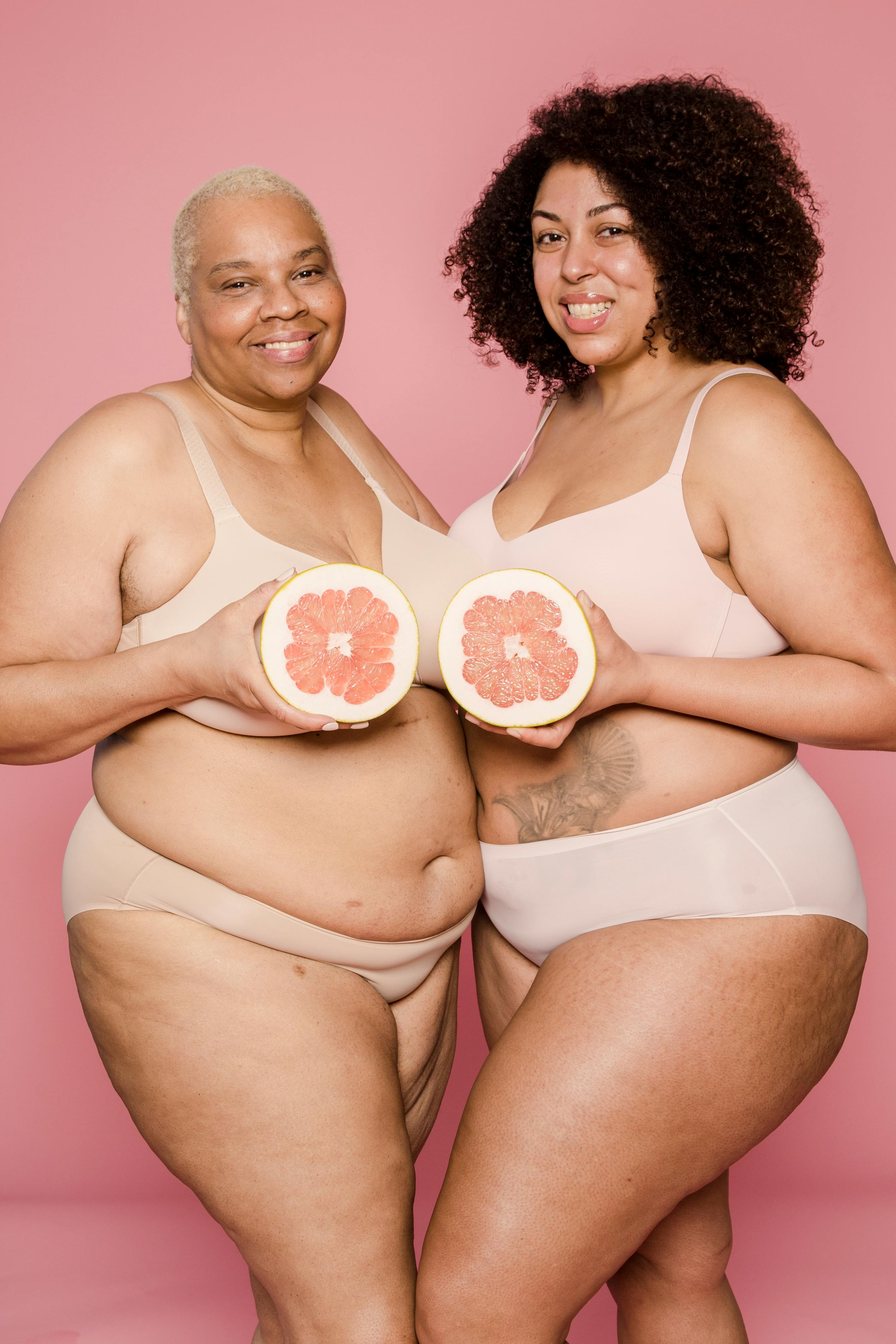 Cheerful plump black women in underwear with melon · Free Stock Photo