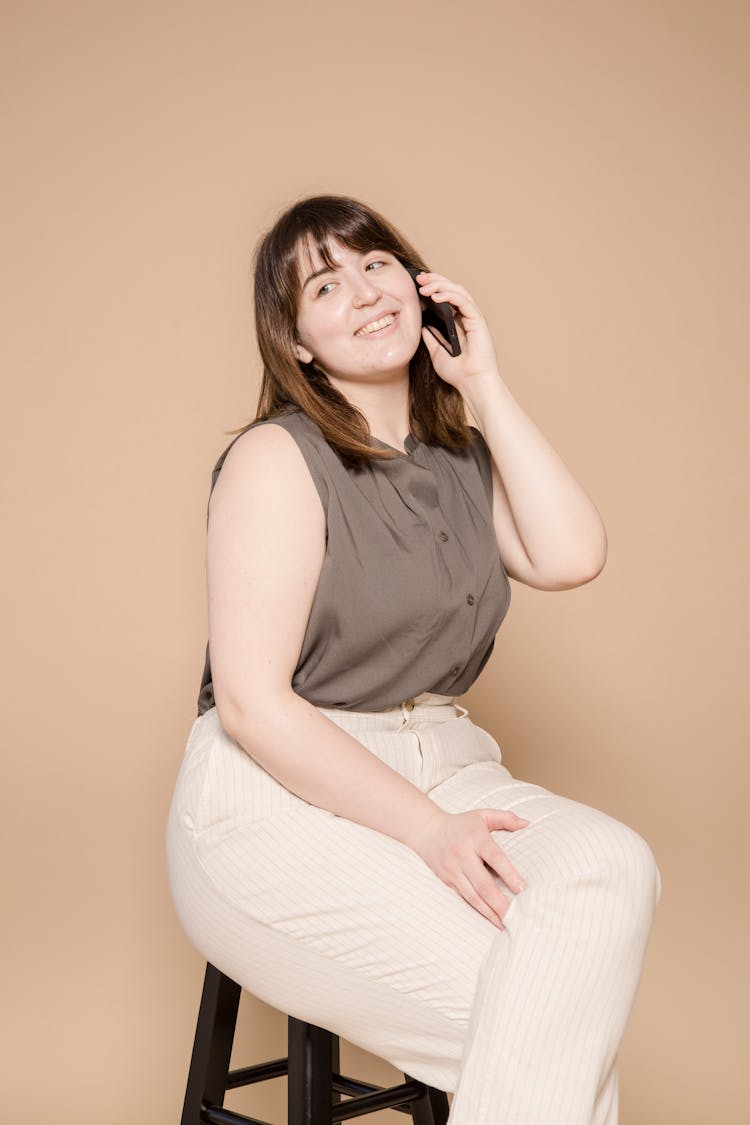 Joyful Asian Woman Having Phone Call