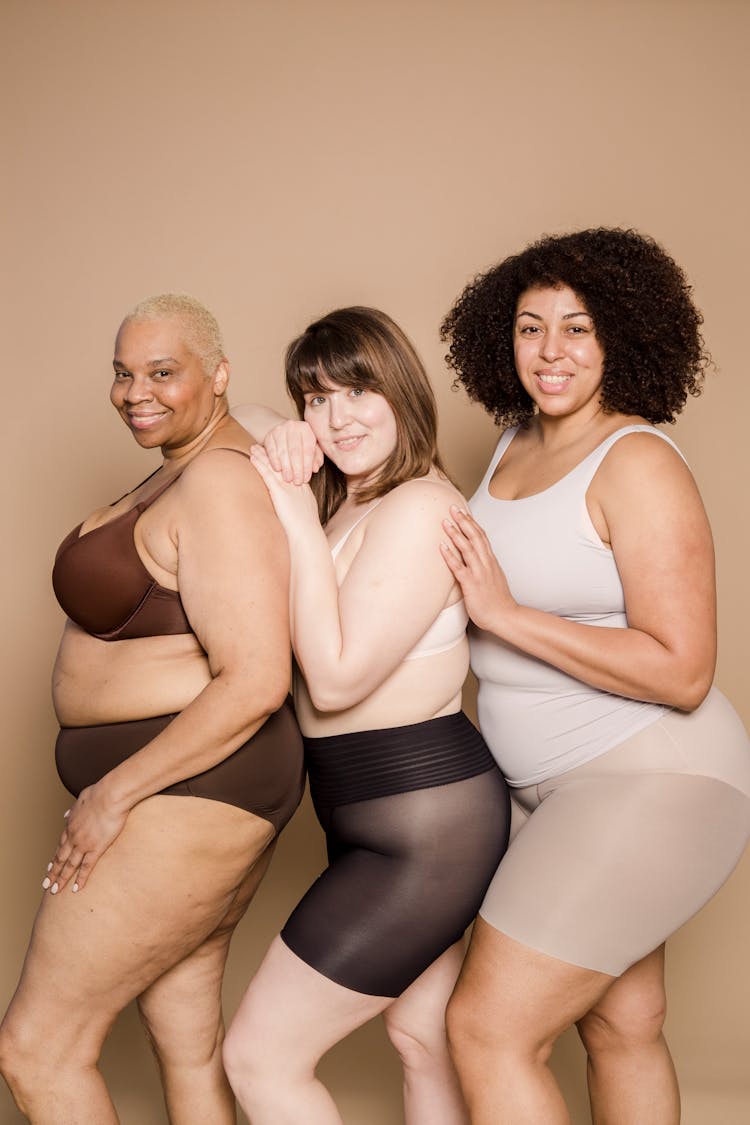 Smiling Plus Size Multiracial Women In Underwear