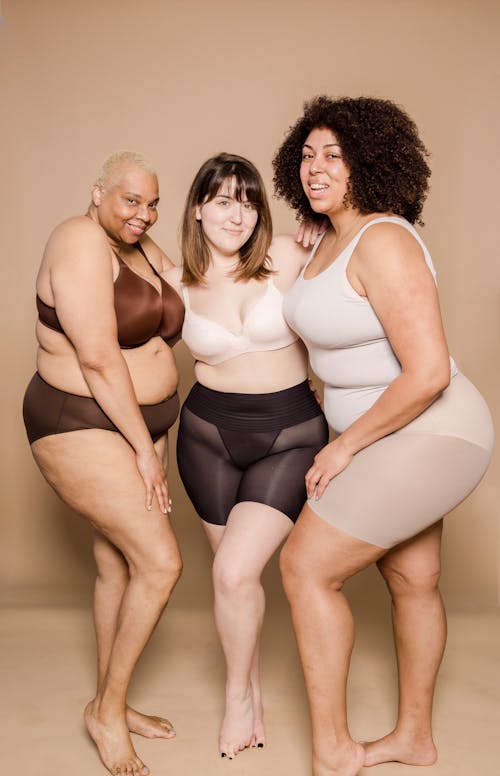 Positive multiracial overweight women in lingerie