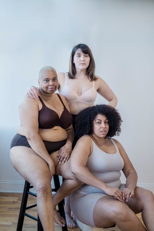 Plus size multiethnic girlfriends in underclothes indoors · Free Stock Photo