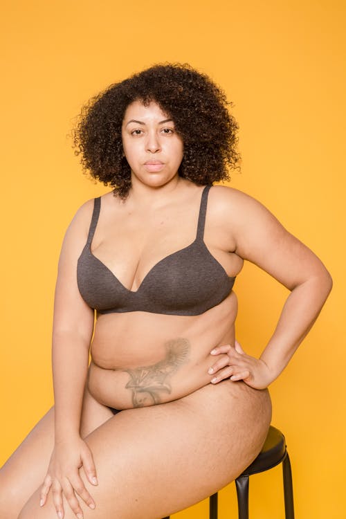 Free Plump African American model in underwear with tattoo Stock Photo