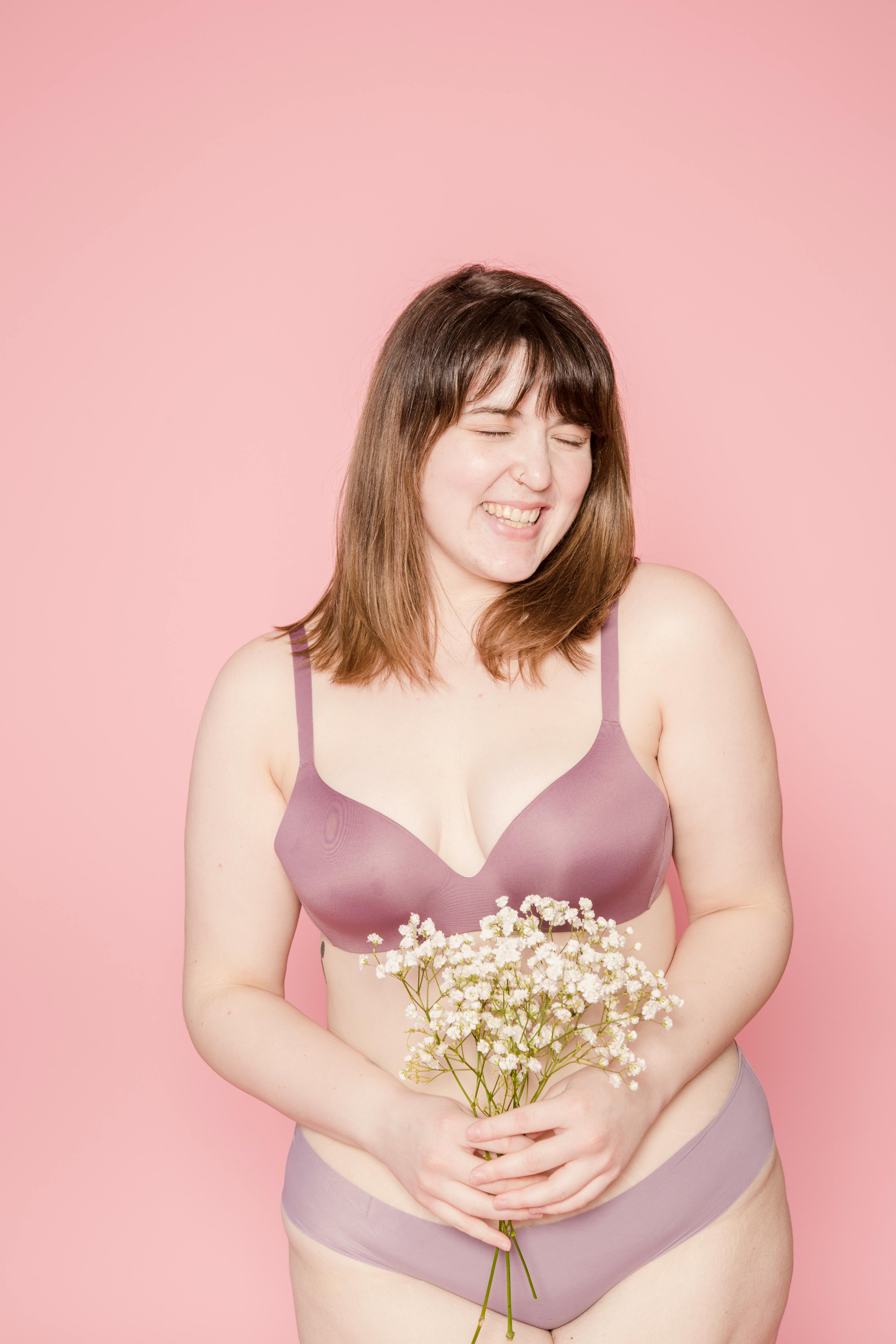 Joyful overweight Asian woman in lingerie with bouquet in hands · Free  Stock Photo