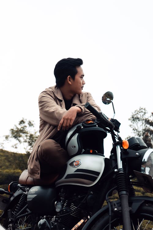 A Man Sitting on a Motorcycle
