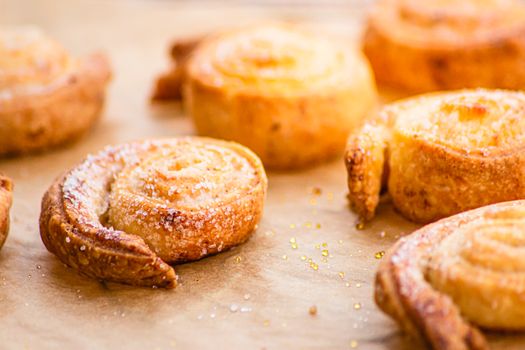 Delicious close-up of golden-brown pastries with sugar dusting, perfect for culinary visuals.