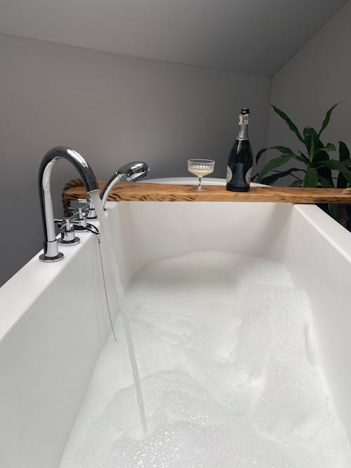 Free White Ceramic Bathtub With Stainless Steel Faucet Stock Photo