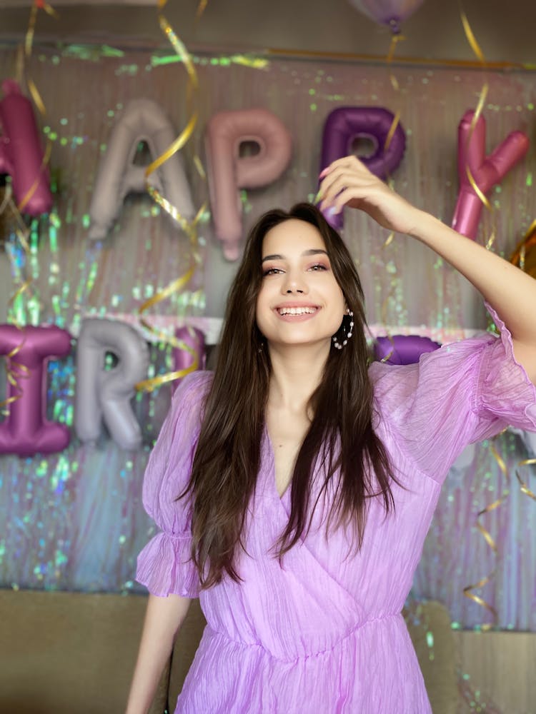 Woman In A Purple Dress Celebrating Her Birthday