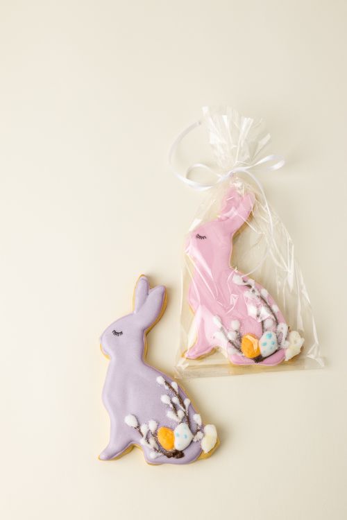 Free Decorative Easter bunny shaped cookies with icing details, wrapped in a clear plastic bag. Stock Photo