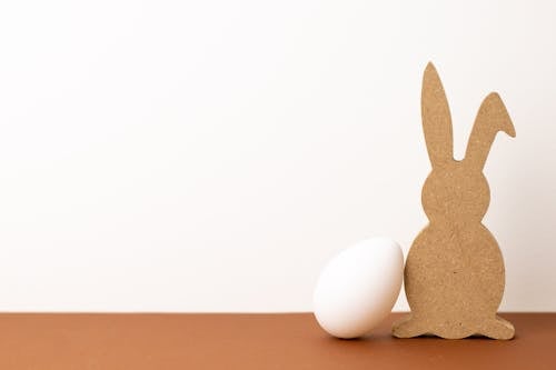 Free Bunny Cut Out  Cardboard Beside an Egg Stock Photo