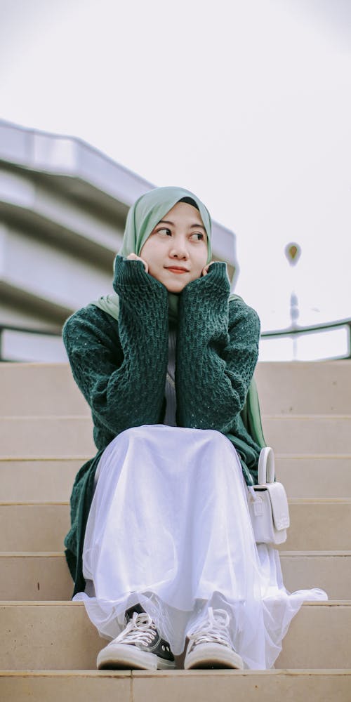 Free A Woman in a Sweater and a Hijab  Stock Photo