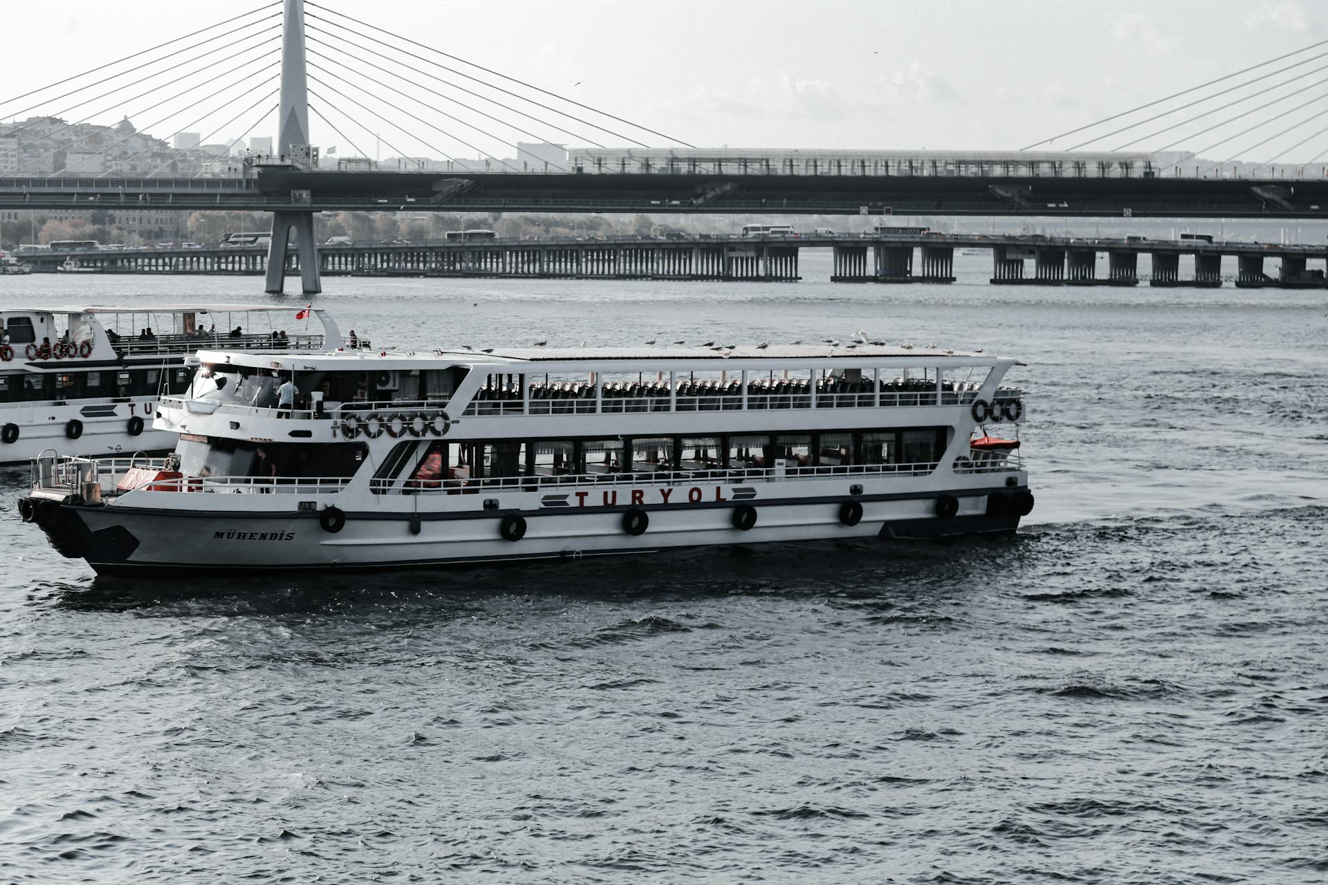 Ferries Sailing on the Sea Near a Bridge