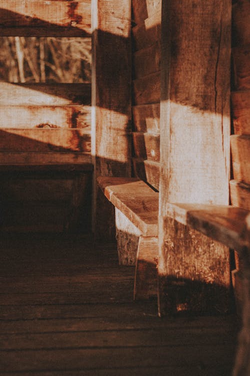 Wooden benches near building in countryside