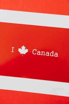 A red card with 'I Love Canada' featuring a maple leaf, symbolizing Canadian patriotism.