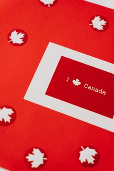 Red card with maple leaves and text 'I love Canada,' symbolizing Canadian patriotism and celebration.