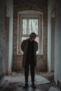 Stylish man in obsolete house